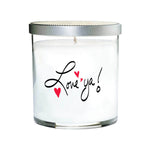 The Love ya Quote Candle is a clear tumbler glass jar with white wax, a silver lid, and "Love 'ya!" plus two red hearts printed on the front.