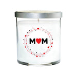 The Mom Quote Candle comes in a clear tumbler glass with a silver lid, featuring "MOM" and a red heart on the front—a hand-poured natural soy candle perfect for gifting.