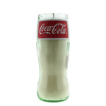 The Recycled Soda Bottle Candle is a hand-poured soy candle set in a glass Coca-Cola bottle with a red label—an eye-catching, eco-friendly accent for any space.