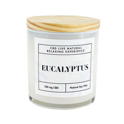 The EUCALYPTUS Relaxing Aromatherapy Candle 11oz is a natural soy candle with 100mg CBD in a glass jar and wooden lid, perfect for soothing relaxation.