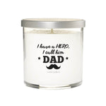 The "I Have a hero, I Called him Dad" candle is a natural soy white candle in a glass jar with a silver lid, featuring a mustache and stars on the label—making it the perfect custom gift for dad.