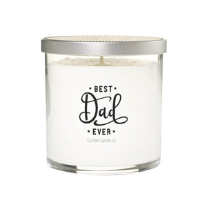 The Best Dad Ever Quote Candle features white soy wax in a clear glass jar with a silver lid. The front label displays "Best Dad Ever Custom Candle Co" in black—an ideal Father’s Day gift.
