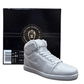 An AJ-1 Gray Sneaker Candle – Large (currently on backorder) is displayed in front of a black Custom Candle Co. box with gold and white lettering.