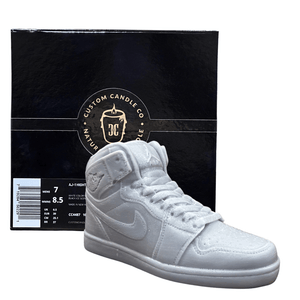 An AJ-1 Gray Sneaker Candle – Large (currently on backorder) is displayed in front of a black Custom Candle Co. box with gold and white lettering.