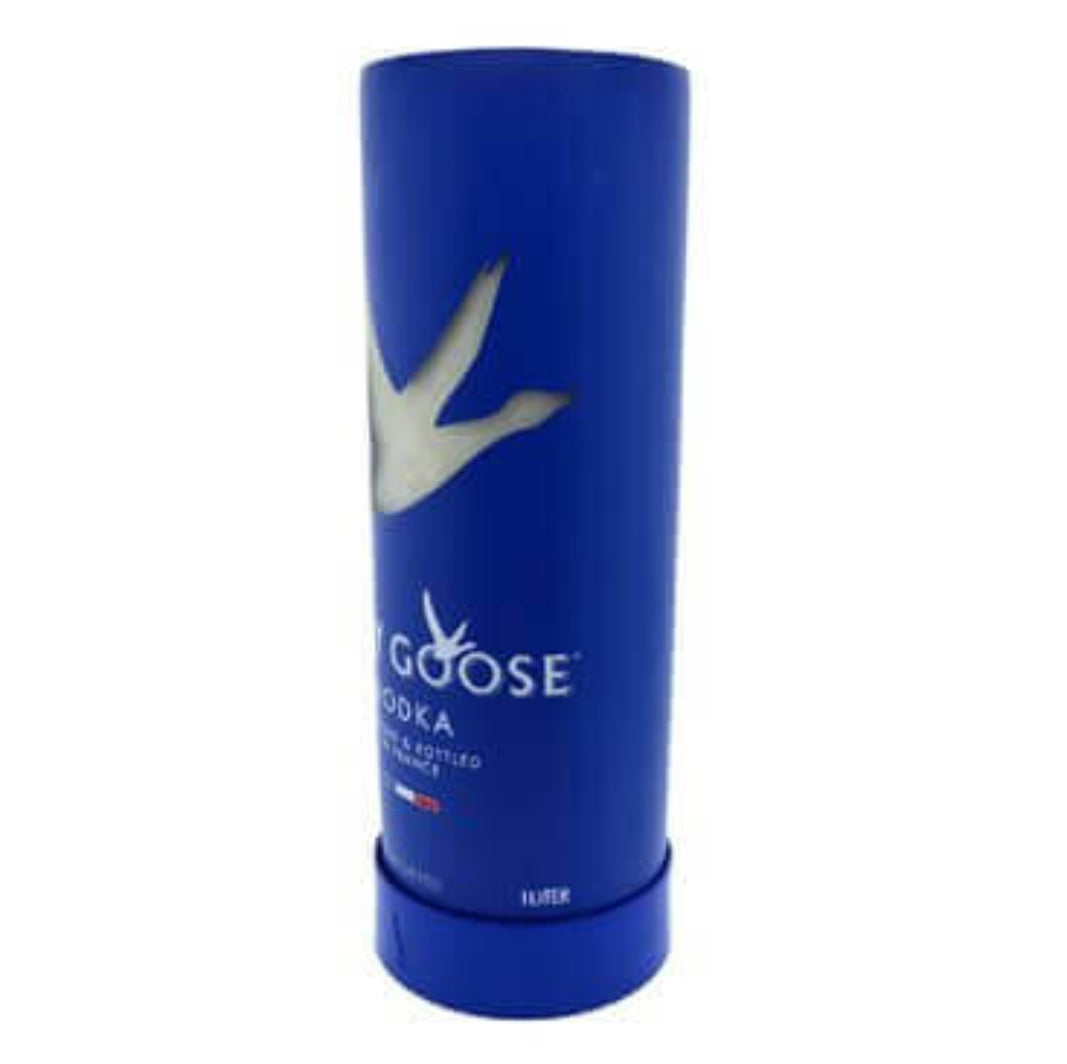 The Recycled French Vodka Candle - Blue is crafted from a 1-liter Grey Goose vodka container with a white goose design, transformed into a soy wax candle.