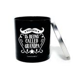 The "Happiness is Being Called Grandpa" candle is a black tin with a silver lid and white text—a natural soy candle that makes an ideal gift for Grandpa.