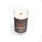 The Dark Holiday Ale Candle is a hand-poured natural soy candle in a beer can-shaped glass with a wooden wick and festive "Holiday Ale" label.