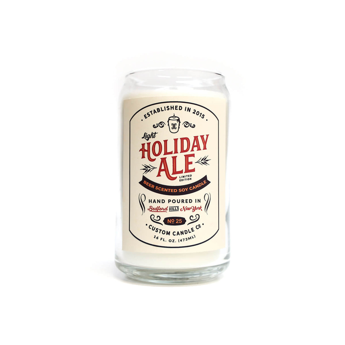 The Light Holiday Ale Candle is a hand poured 16 oz natural soy candle in a glass jar, featuring a vintage-style "Holiday Ale" design on the front.