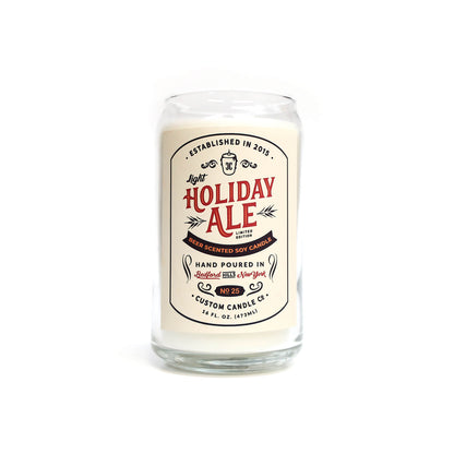 The Light Holiday Ale Candle is a hand poured 16 oz natural soy candle in a glass jar, featuring a vintage-style "Holiday Ale" design on the front.
