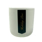 The Holiday Scented Boxed Candle – Holiday Pine Scent features a white ceramic container with a black "Holiday Pine" gold-script label and is made from a natural soy wax blend for a clean, festive fragrance.