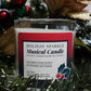 The Musical Holiday Candle – Holiday Sparkle is a glass jar soy candle displayed with festive décor, ideal for anyone who enjoys musical Christmas candles.