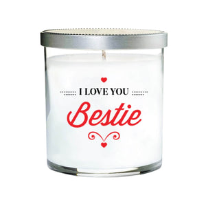 The I Love You Bestie Quote Candle comes in a clear tumbler glass with a silver lid, featuring "I LOVE YOU Bestie" and red hearts. This hand poured soy candle is the perfect gift for your bestie.
