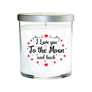 The "I Love You to the Moon and back Quote Candle" features a hand-poured candle in a clear tumbler glass jar, silver lid, and the loving quote on the front, accented with small red and purple decorations.