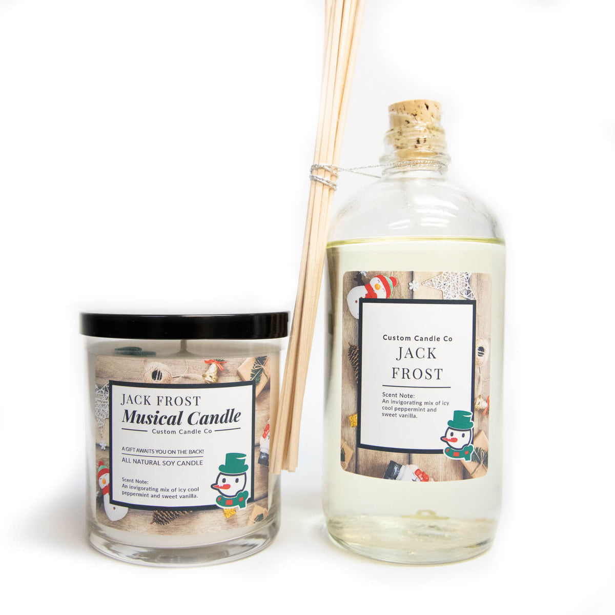 The Musical Holiday Candle & Diffuser | Jack Frost features snowman labels and festive decor—perfect for scented candle fans. Includes a holiday candle and reed diffuser with wooden sticks, set against a white background.