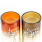 The Recycled Sunset-Colored Reposado Tequila Candle is crafted from Milagro Tequila bottles in vibrant orange and yellow—eco-friendly, unique décor for tequila lovers.