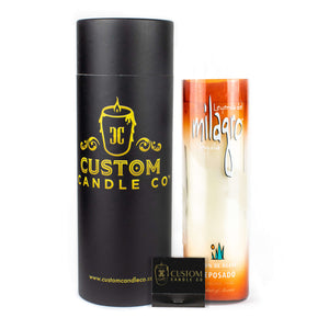 A black cylindrical Custom Candle Co. container, a tall Recycled Sunset-Colored Reposado Tequila Candle, and a small black Custom Candle Co. matchbox are displayed side by side.