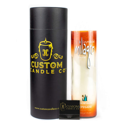 A black cylindrical Custom Candle Co. container, a tall Recycled Sunset-Colored Reposado Tequila Candle, and a small black Custom Candle Co. matchbox are displayed side by side.