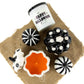 Create a festive scene with Halloween-themed burlap decor, a "Happy Halloween" scented candle, and the Ceramic Mini Polka White Pumpkin Candle for a touch of cozy charm.