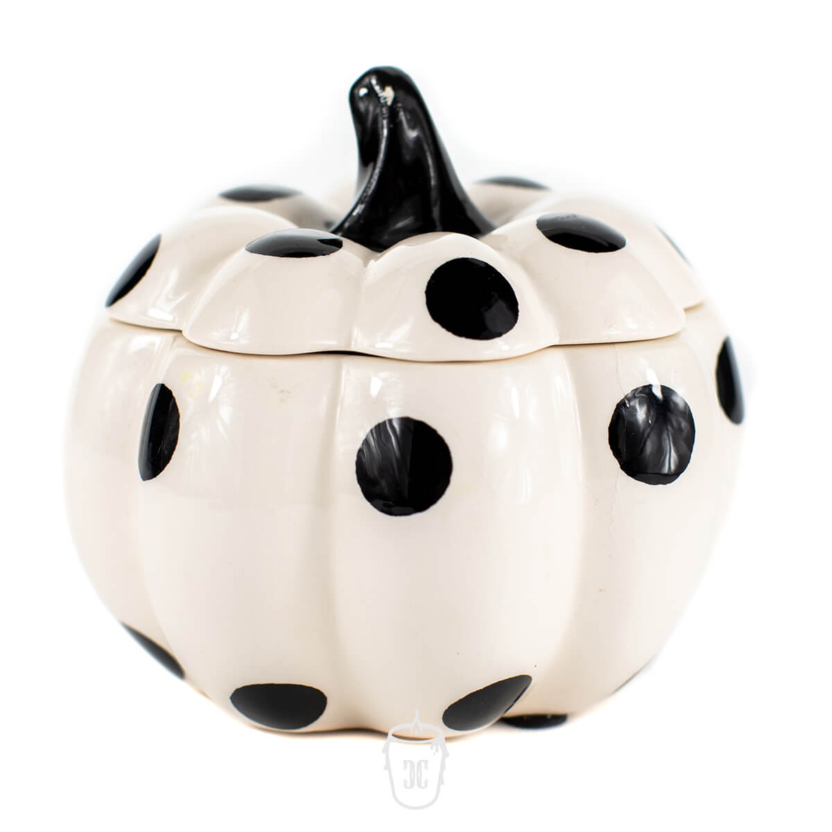 The Ceramic Mini Polka White Pumpkin Candle features a white ceramic container with large black polka dots and a black stem, perfect for holding soy candles or your favorite scented candle. Shown on a white background.