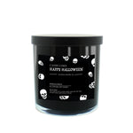 The Musical Halloween Candle – Candy Corn Black is a soy candle in a black jar with a black lid, featuring a label with white skulls and "Candy Corn Happy Halloween Custom Candle Co." text, set against a white background.
