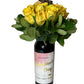 Wine and Flowers features a Cabernet bottle adorned with a label, topped with yellow roses, green leaves, and a cute teddy bear—an ideal romantic gift.