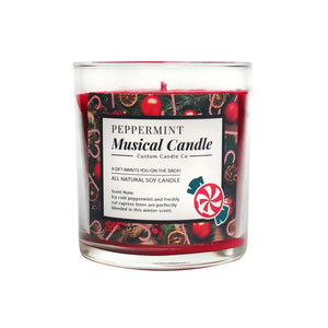 The Musical Holiday Candle – Peppermint is an all-natural soy candle in a festive jar with red wax, featuring peppermint and cypress scents. Part of our scented holiday candles collection.