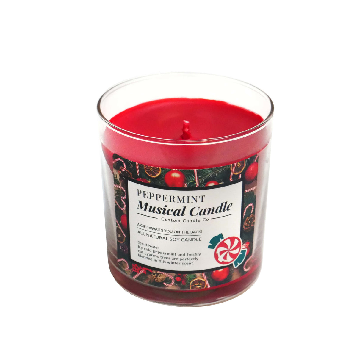 The Musical Holiday Candle – Peppermint is a red, peppermint-scented soy candle in a clear glass jar with festive holiday designs—perfect for anyone who loves scented holiday candles.