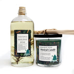 The Musical Holiday Candle & Diffuser | Holiday Pine set includes festive pine-adorned diffuser oil with reeds and a green soy candle in a jar, perfect for filling your home with musical Christmas cheer.