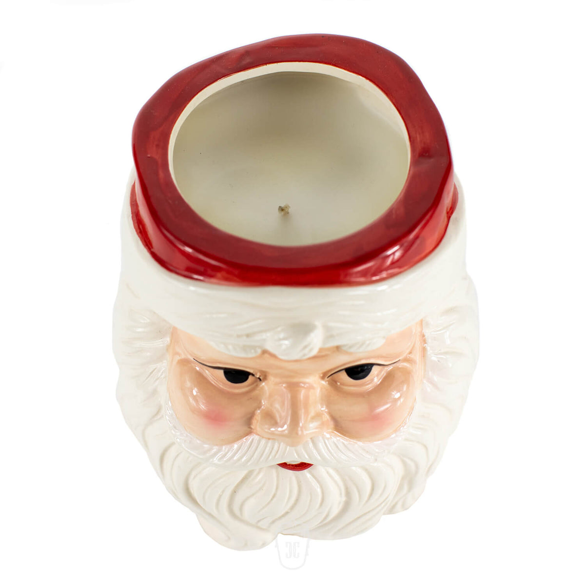 The Santa Claus Holiday Candle is hand poured and shaped like Santa Claus’s head, featuring an open top that reveals all-natural soy wax inside.