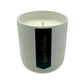 The Holiday Scented Boxed Candle – Sugar Cookie Scent is a white soy candle in a simple cylinder with a black "Sugar Cookie" label, filling your space with a cozy sugar cookie aroma—ideal for the holidays.