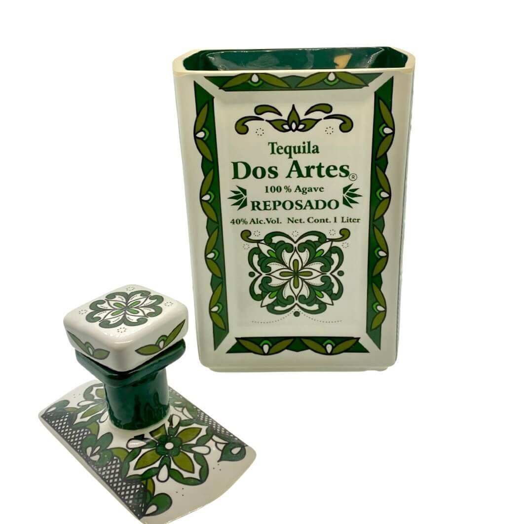 The Recycled Ceramic Tequila Candle – Flat Cut features a ceramic tequila bottle with green floral patterns, repurposed with coconut-apricot wax. 100% agave, 1L, 40% Alc./Vol.—perfect for unique candle decor.