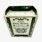 The Recycled Ceramic Tequila Candle – Flat Cut features two wicks and coconut-apricot wax, set in a rectangular, recycled ceramic vessel inspired by Dos Artes Reposado tequila bottles.