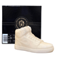 The AJ-1 White Hightop Sneaker Candle – Large (On Backorder) is a hand-poured candle shaped like a white sneaker, displayed in front of a black "Custom Candle Co." box with product details on the left.